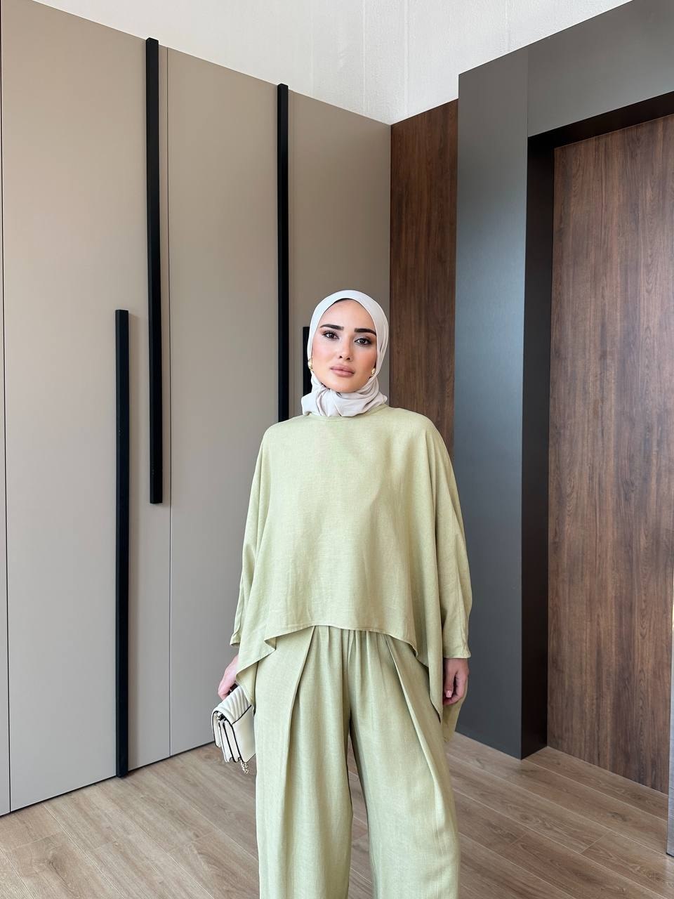 The Solene Draped Set - Sage green walking pose