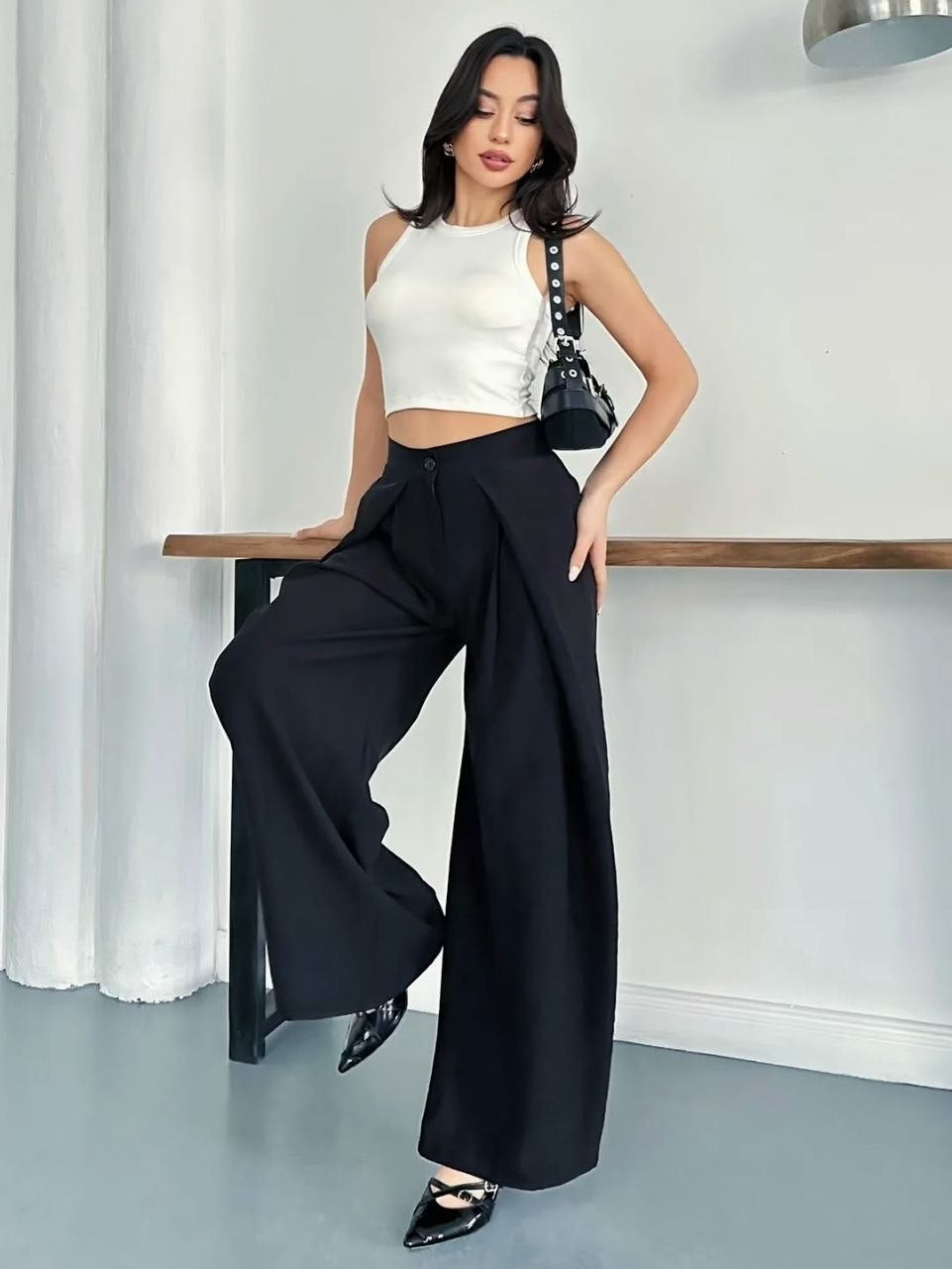 Overlap Pleat Wide-Leg Trousers - Side leaning pose